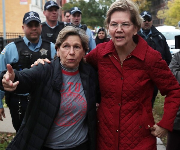 randi weingarten and elizabeth warren walk with arms around each other