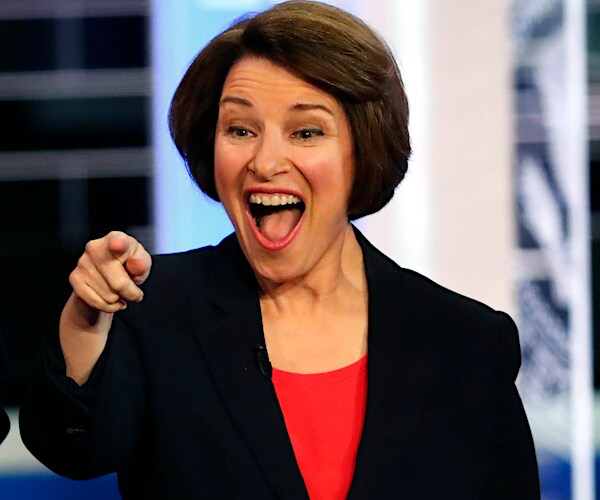 amy klobuchar points and laughs wide