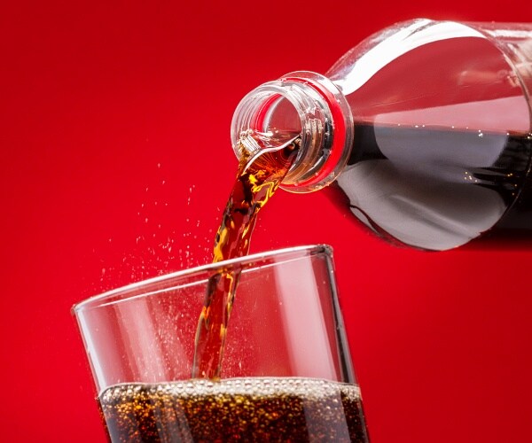 pouring sugary drink