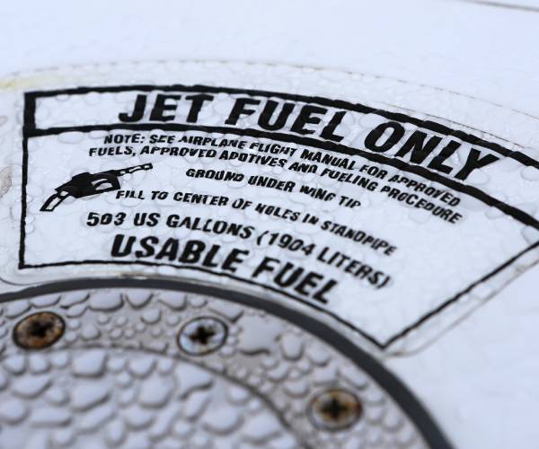 a sticker on a plane reading jet fuel only
