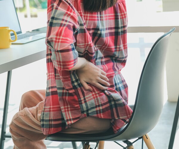 a woman suffering from lower back pain