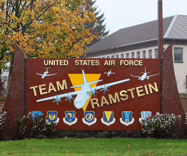 a sign for team ramstein is outside the air force base in germany