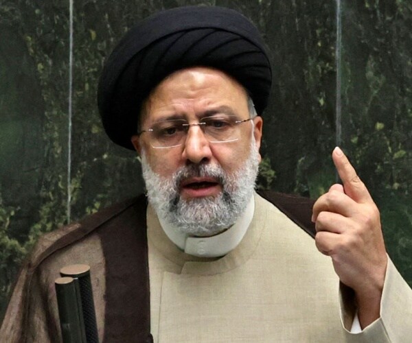 iranian president ebrahim raisi speaks and points finger up