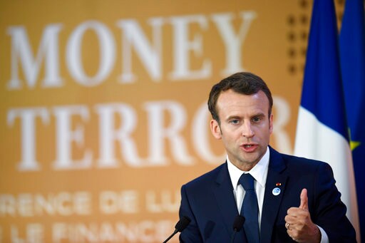 The Latest: Macron Hails Pledge to Fight Terror Financing