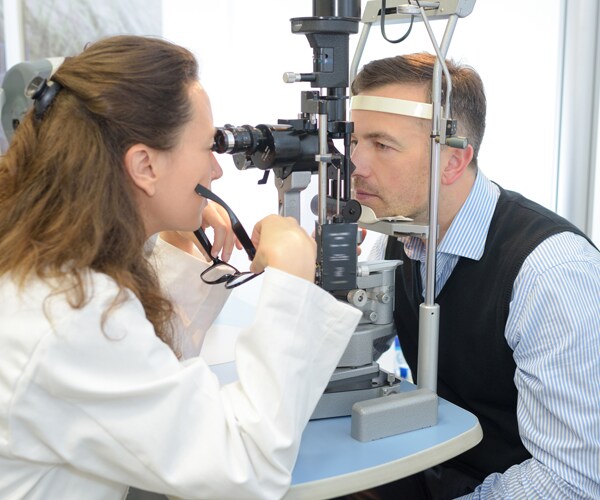 a man at the eye doctor