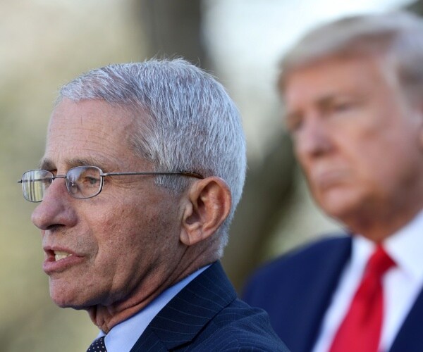 dr. fauci and president trump outside in the rose garden giving a press briefing
