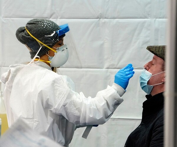 medic swabs mans nose