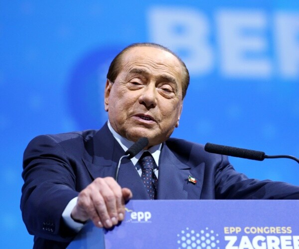 Italian Prime Minister Silvio Berlusconi speaks at a summit.