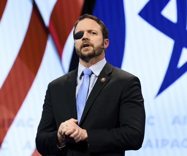 dan crenshaw stands with his eye patch over his right eye