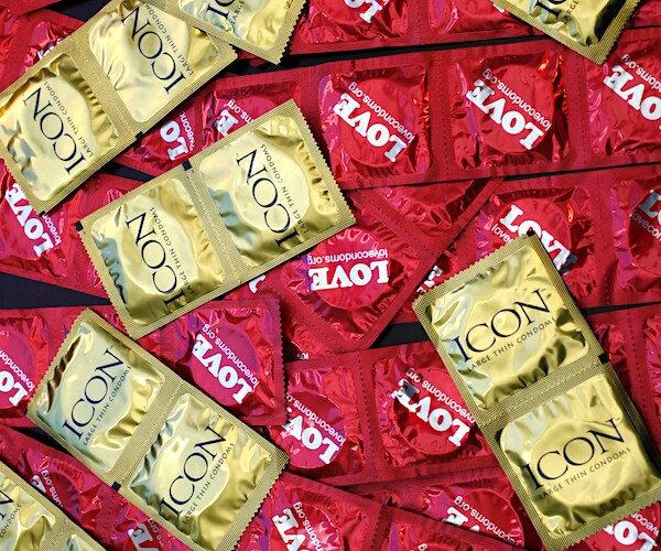 condoms lay in a large pile on a table