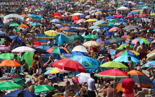 On Hottest Day of Year, Thousands Cram onto English Beaches