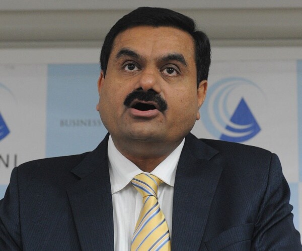 Gautam Adani speaking at a press conference.