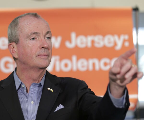 phil murphy points to a reporter as he answers questions