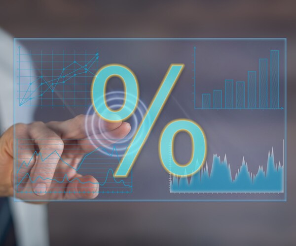 a man touching a screen with a percent sign on it