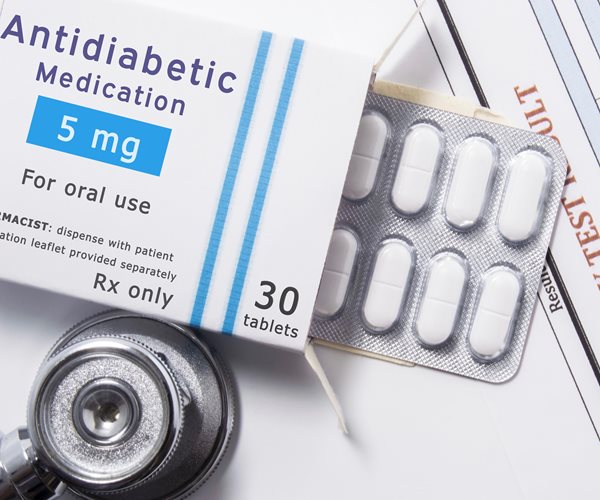 box of generic antidiabetic caplets with stethoscope