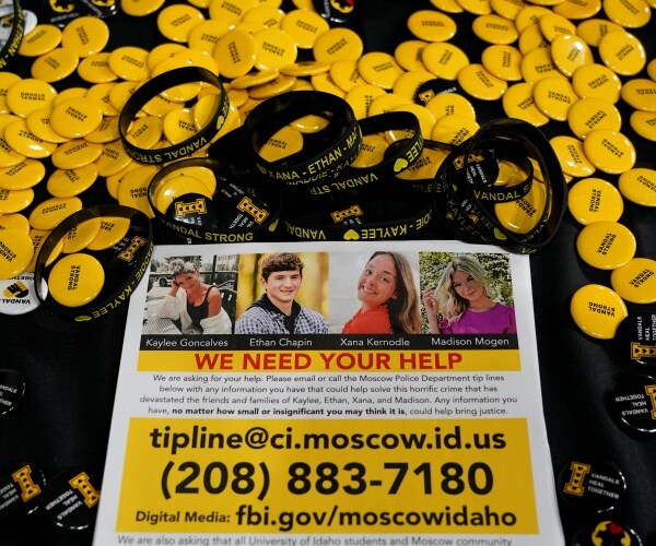 a flyer seeking information about the killings of four university students