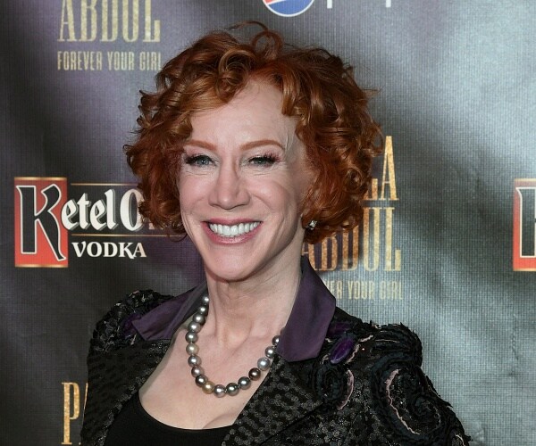 kathy griffin stands on red carpet
