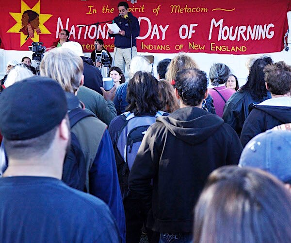 a crowd of gathers during the 38th national day of mourning on thanksgiving day