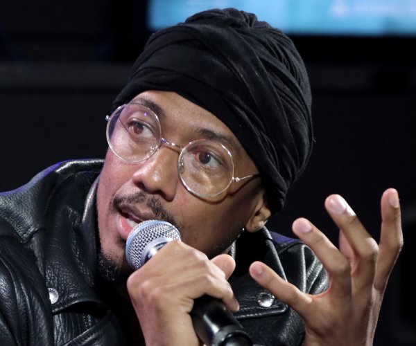 nick cannon speaking to a crowd
