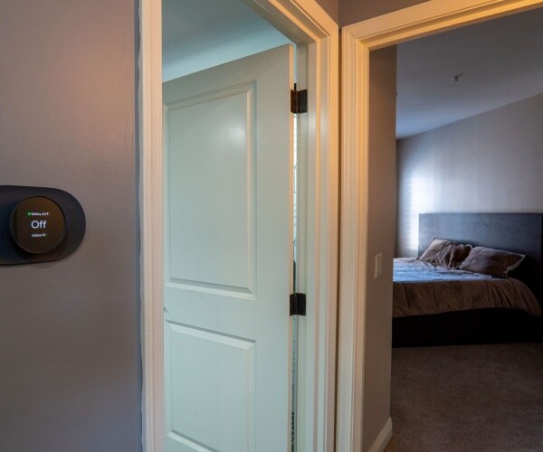 thermostat on wall outside bedroom