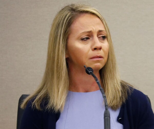 amber guyger in tears before a mic