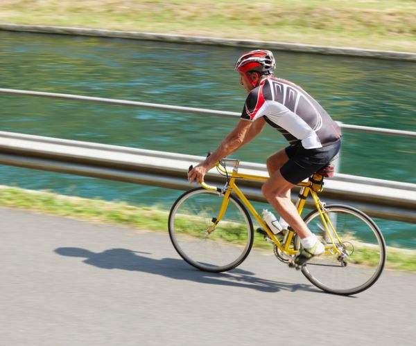 senior bicyclist on road bike