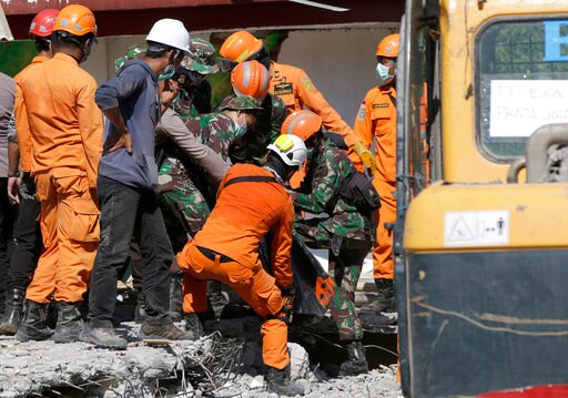 The Latest: Indonesia Survivor Says Many Buried in Mosque