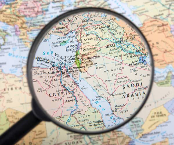 a map of the middle east shown under a magnifying glass