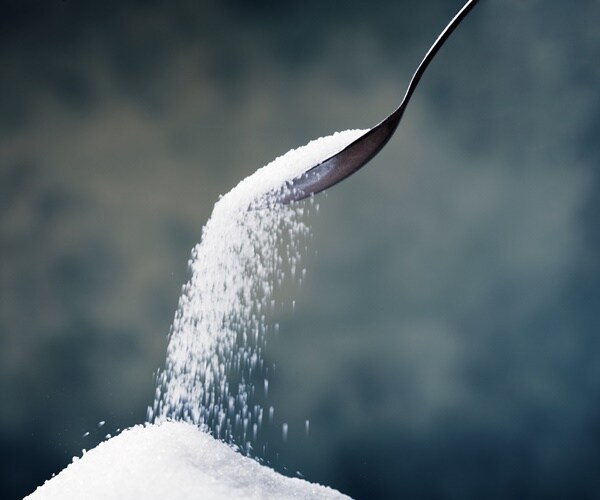 sugar poured from a spoon