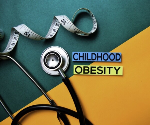 a tapemeasure and a stethoscope surround childhood obesity