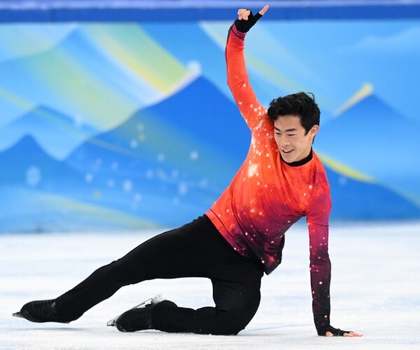Nathan Chen skates on ice