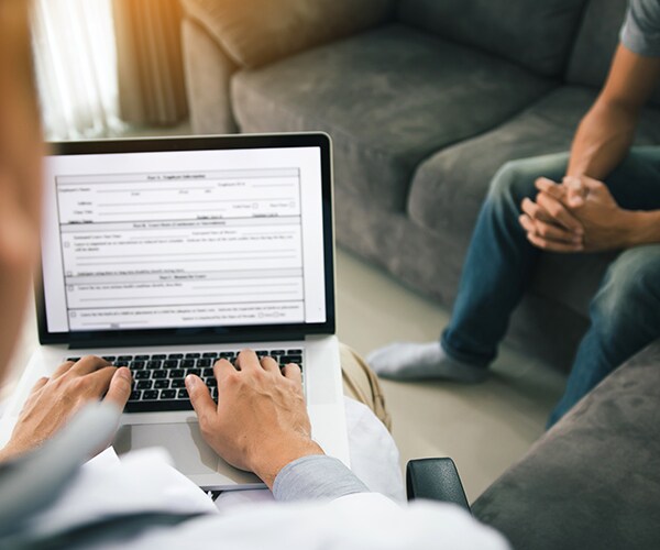 a closeup of a person looking at medical records on a tablet