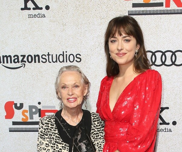 tippi hedren and dakota johnson stand on red carpet