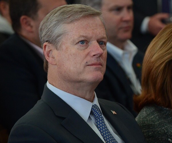 governor charlie baker listens at the unveiling of the draftkings' headquarters