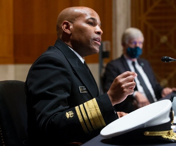 US Surgeon General Jerome Adams speaks in the capitol