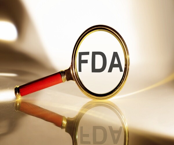 A magnifying glass looking at FDA 