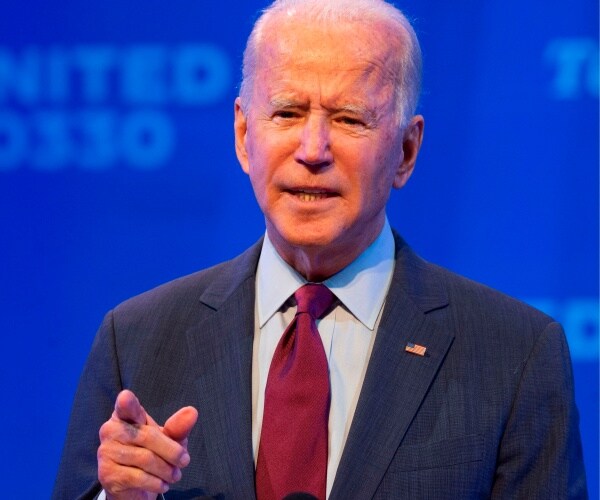 joe biden stands onstage