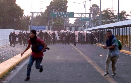 1 Migrant Dies as 2nd Group Tries to Force Entry into Mexico