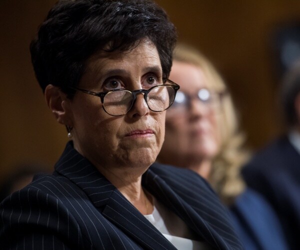 debra katz wears reading glasses