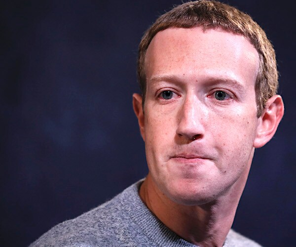 facebook founder mark zuckerberg sits contrite before reporters