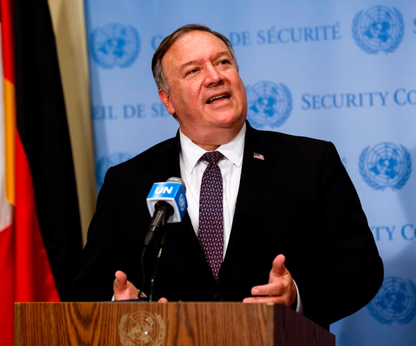 mike pompeo stands behind a microphone at the united nations
