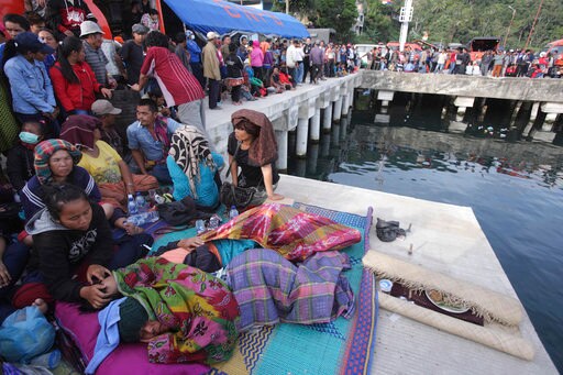 Hundreds Wait at Indonesia Lake as Search for Bodies Resumes
