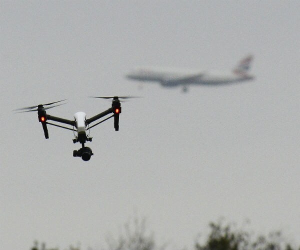 drone shown with airplane in background