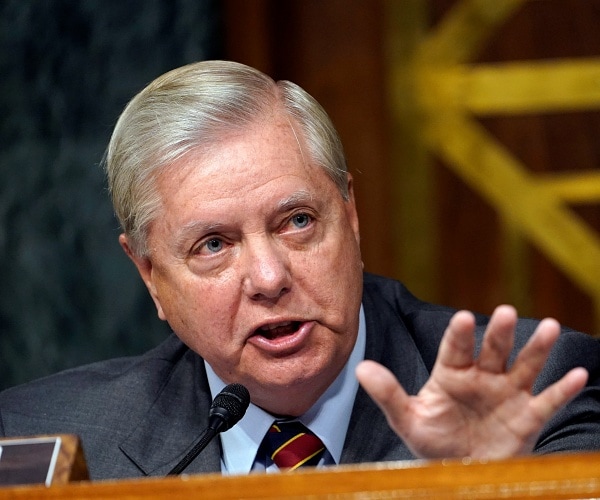 lindsey graham holds up hand