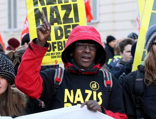 The Latest: Austria Voter Comments Reflect Tight Race