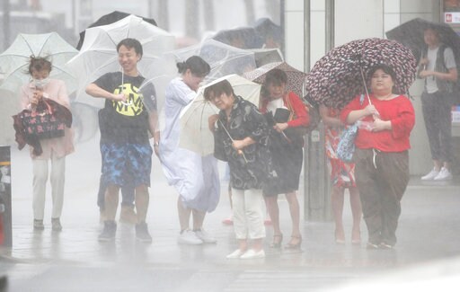2 Typhoons Weaken after Pounding South Korea and Japan