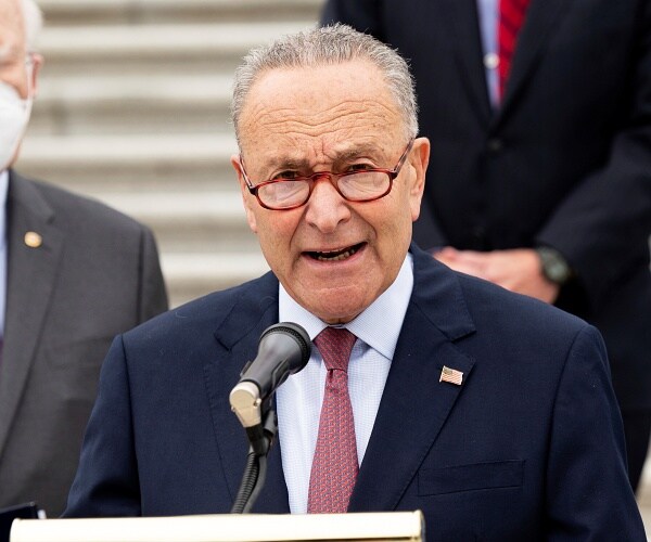 chuck schumer speaks from podium