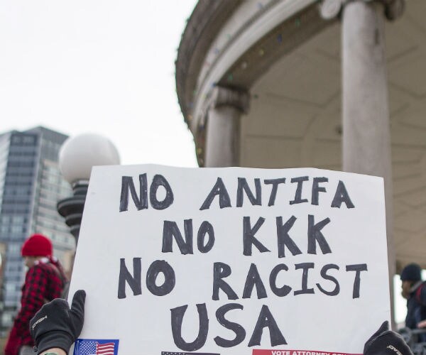 sign no antifa, no kkk no racist usa boston common 