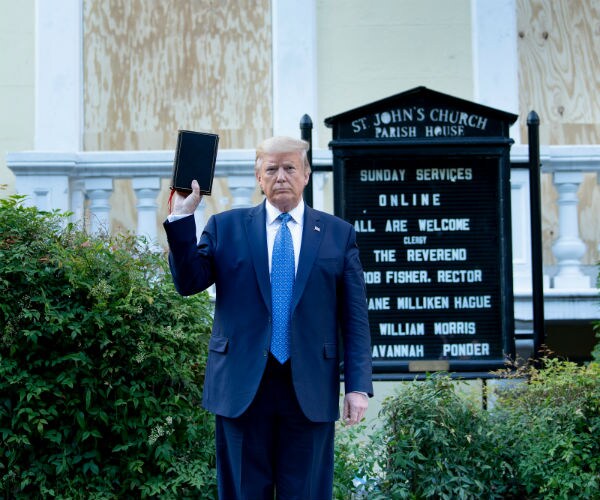 donald trump holds a Bible while visiting St. John's Church 