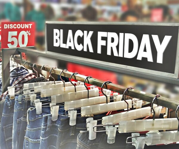 clothing on racks in a mall store